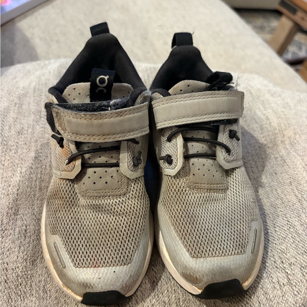 On cloud, blue tennis shoes